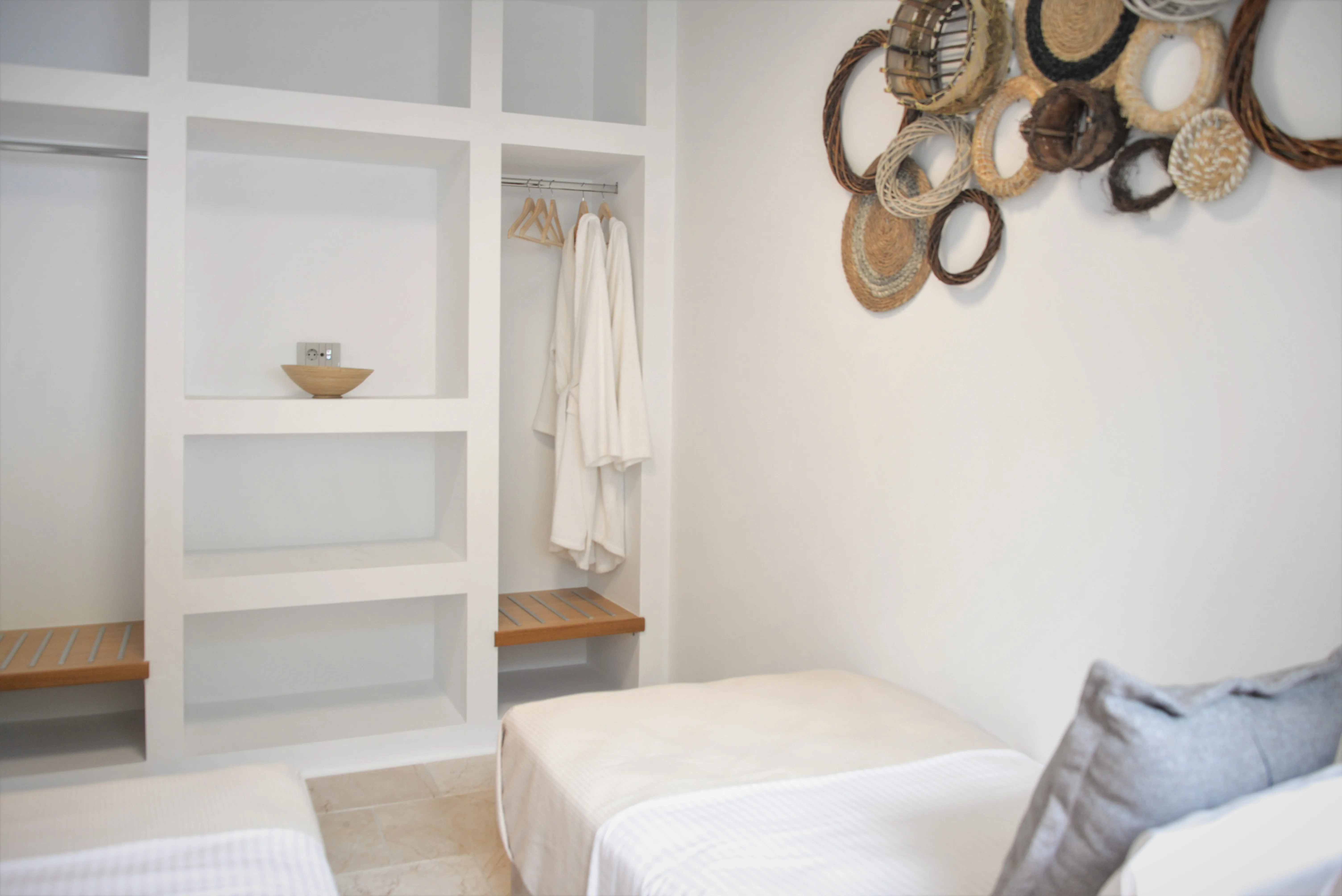 Second bedroom with single bed and open wardrobe with robes
