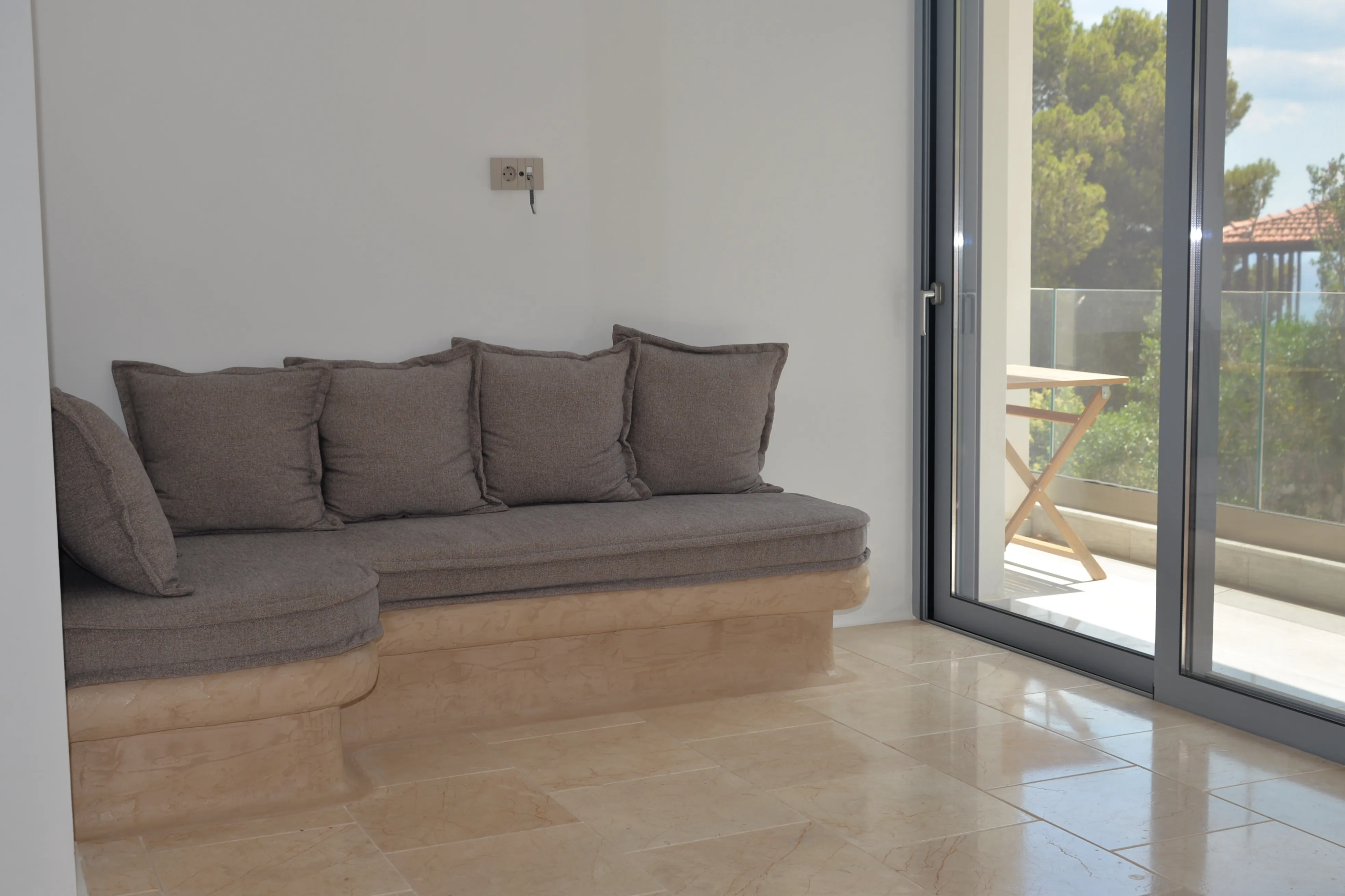 Corner sofa of Lips beside the balcony door