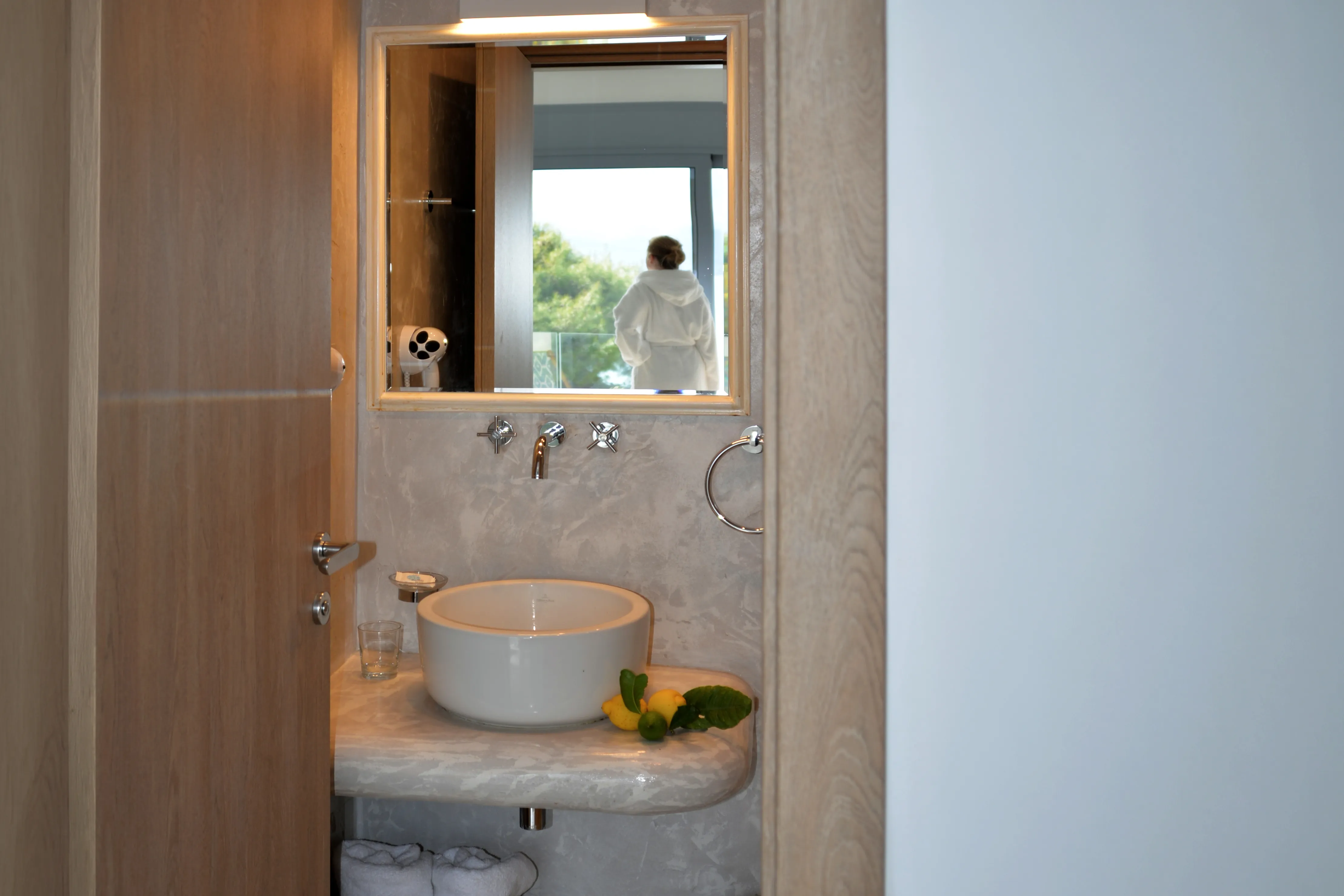 Euros bathroom mirror reflecting the room and balcony