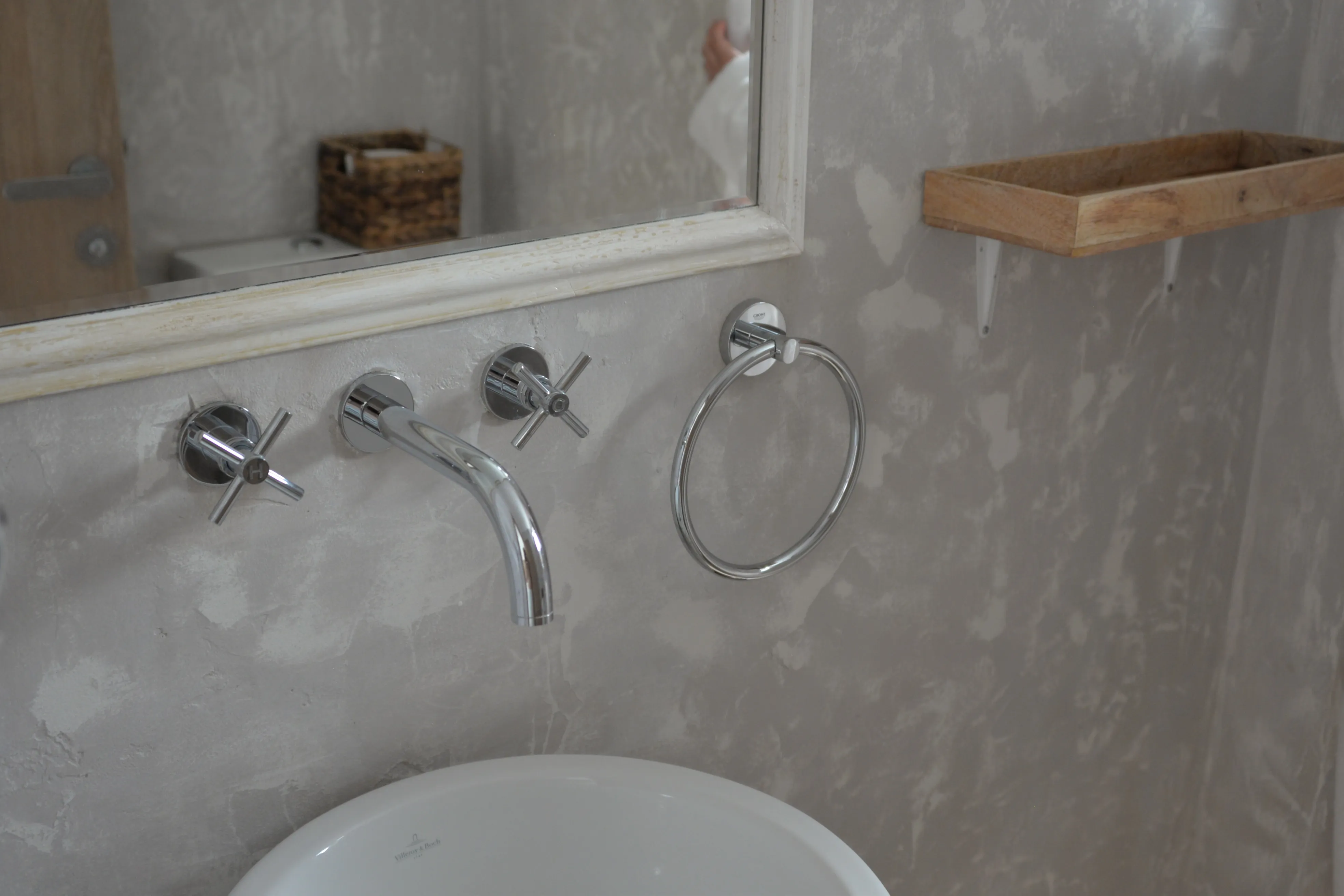 Wall-mounted taps over the basin in the Lips bathroom
