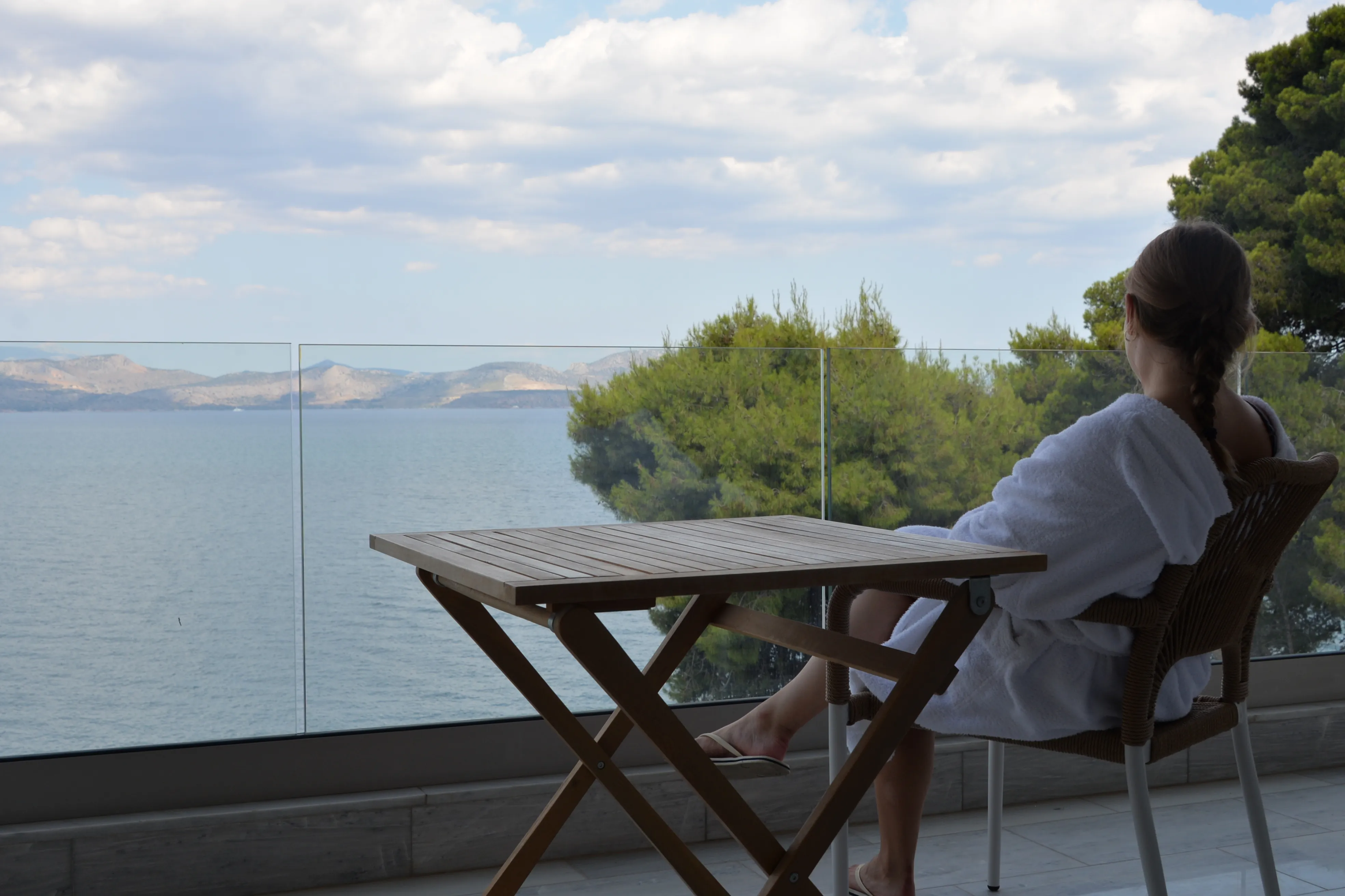 Balcony table of Kaikzas above the sea and pines
