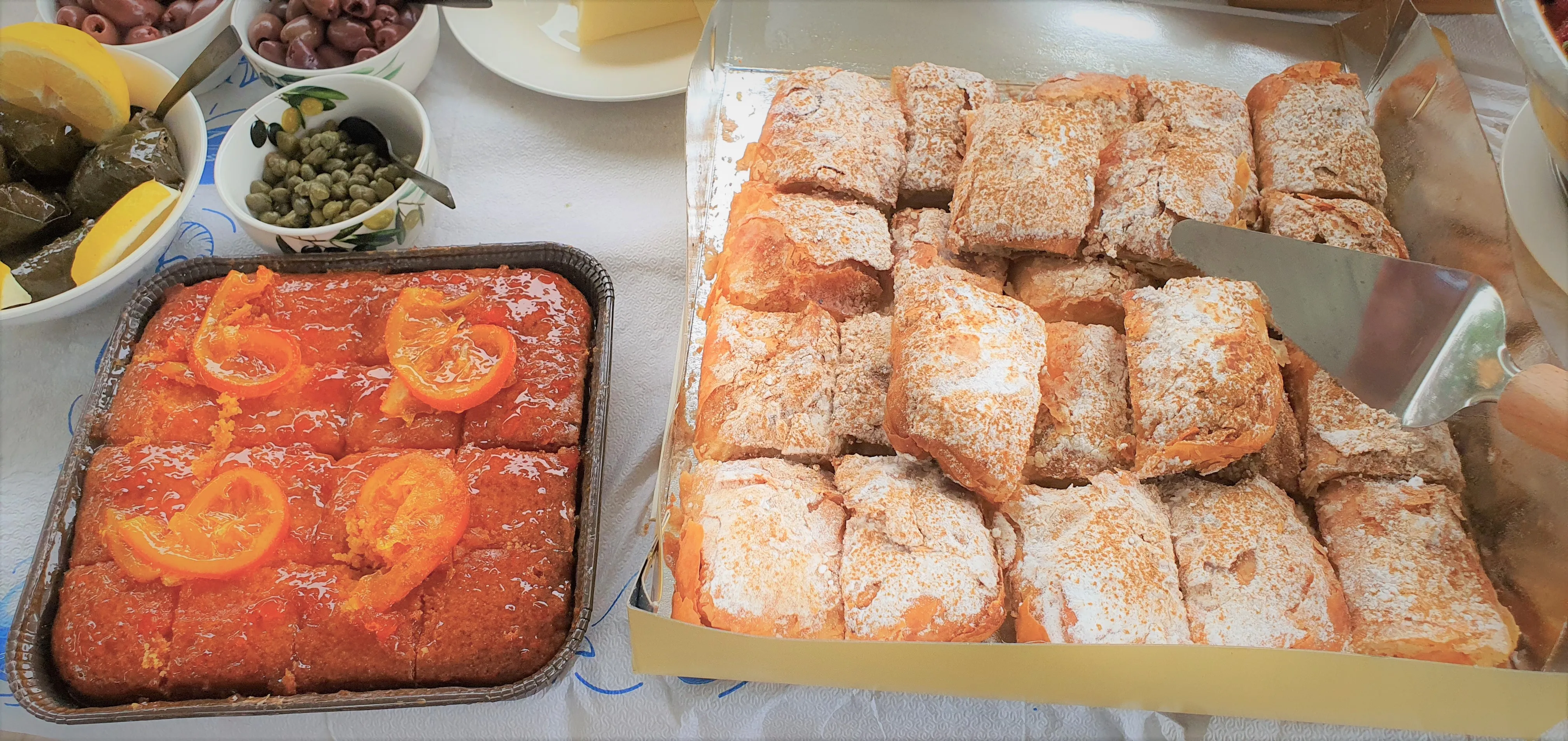Homemade pastries dusted with sugar in baking trays
