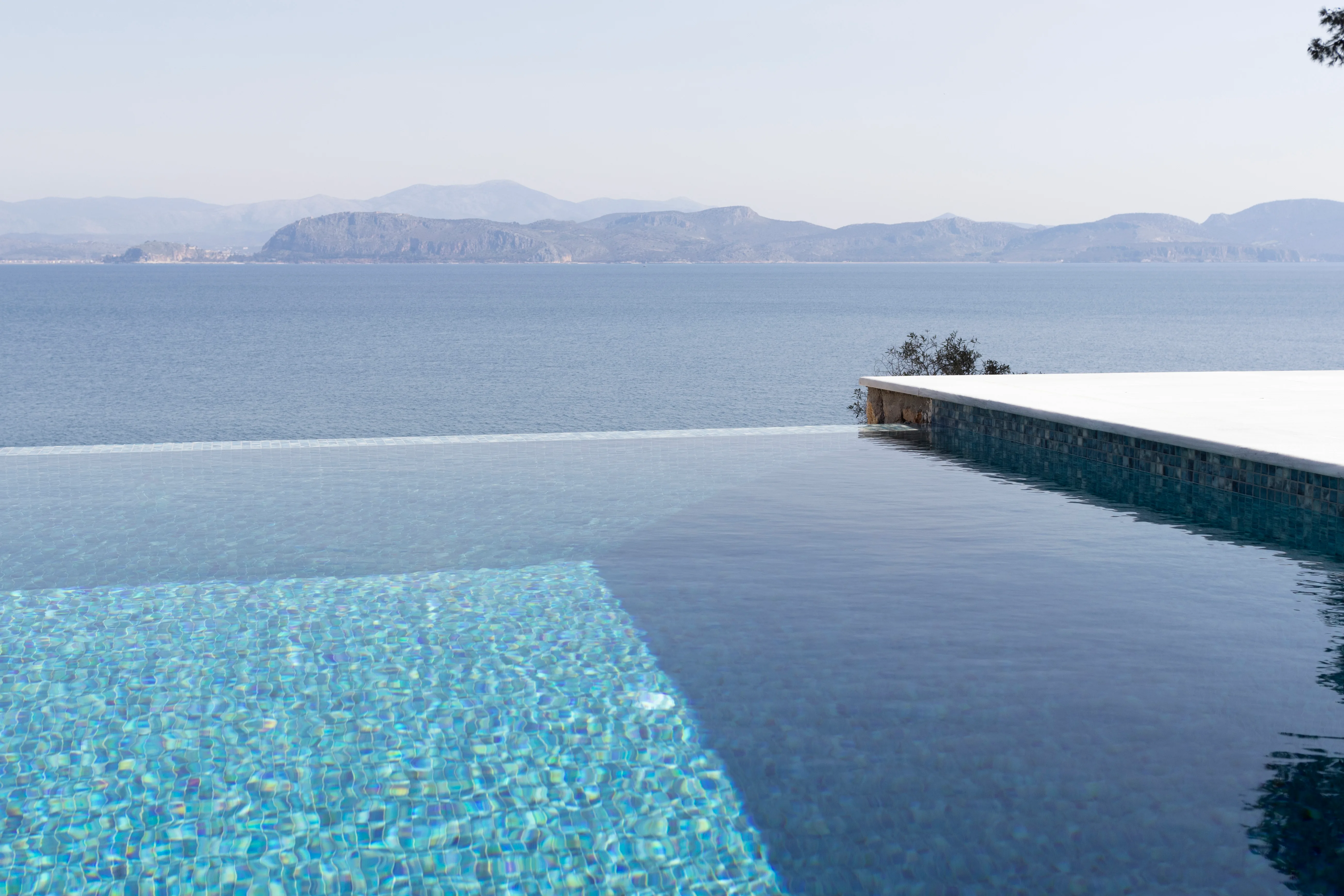 Corner of the mosaic infinity pool above the open gulf